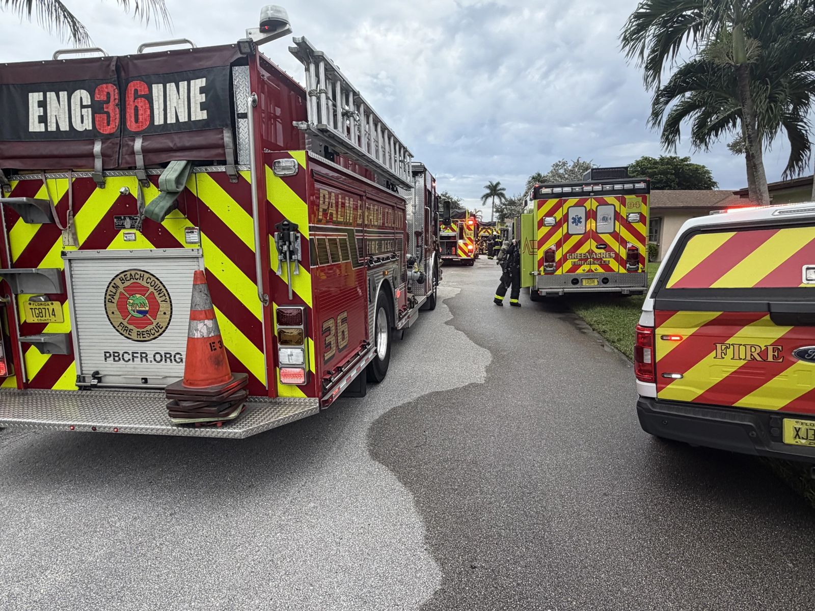 Palm Beach County Fire Rescue Engine 36 and Greenacres Fire Rescue units parked at an incident